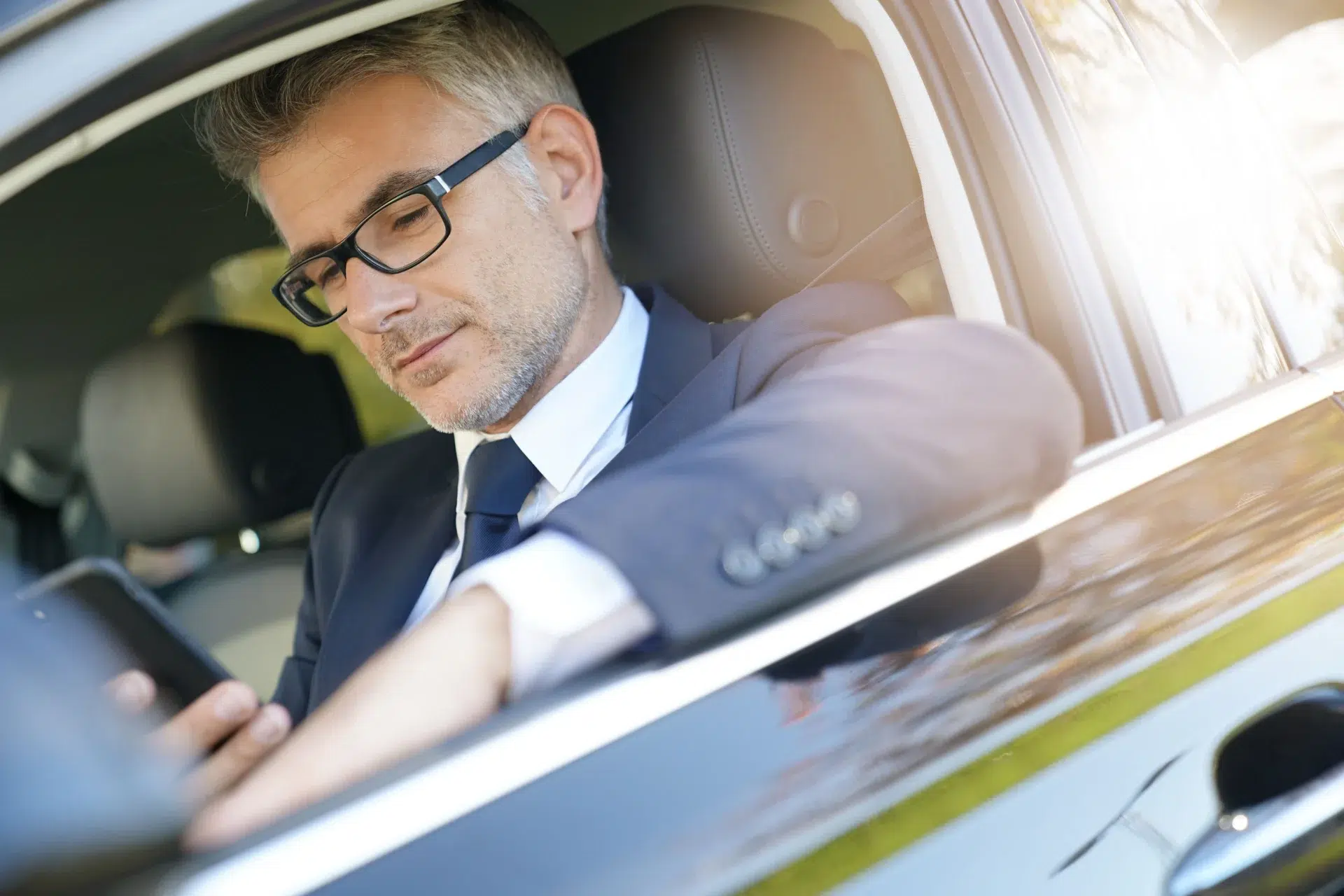 Professional chauffeur preparing a premium journey